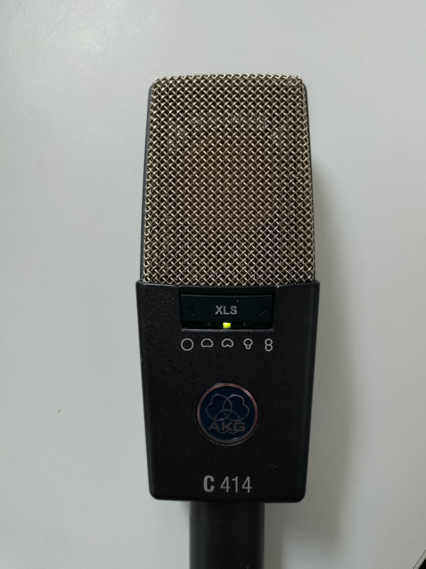 Close-up of AKG C414 microphone with directionality-switching interface visible