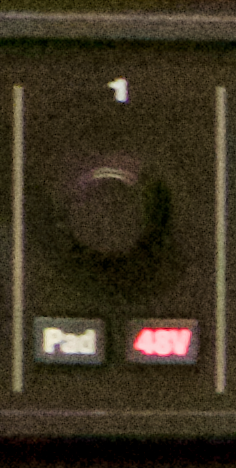 Close-up of channel 1 of a MOTU 8M audio interface, showing dial for gain and 48V phantom power button